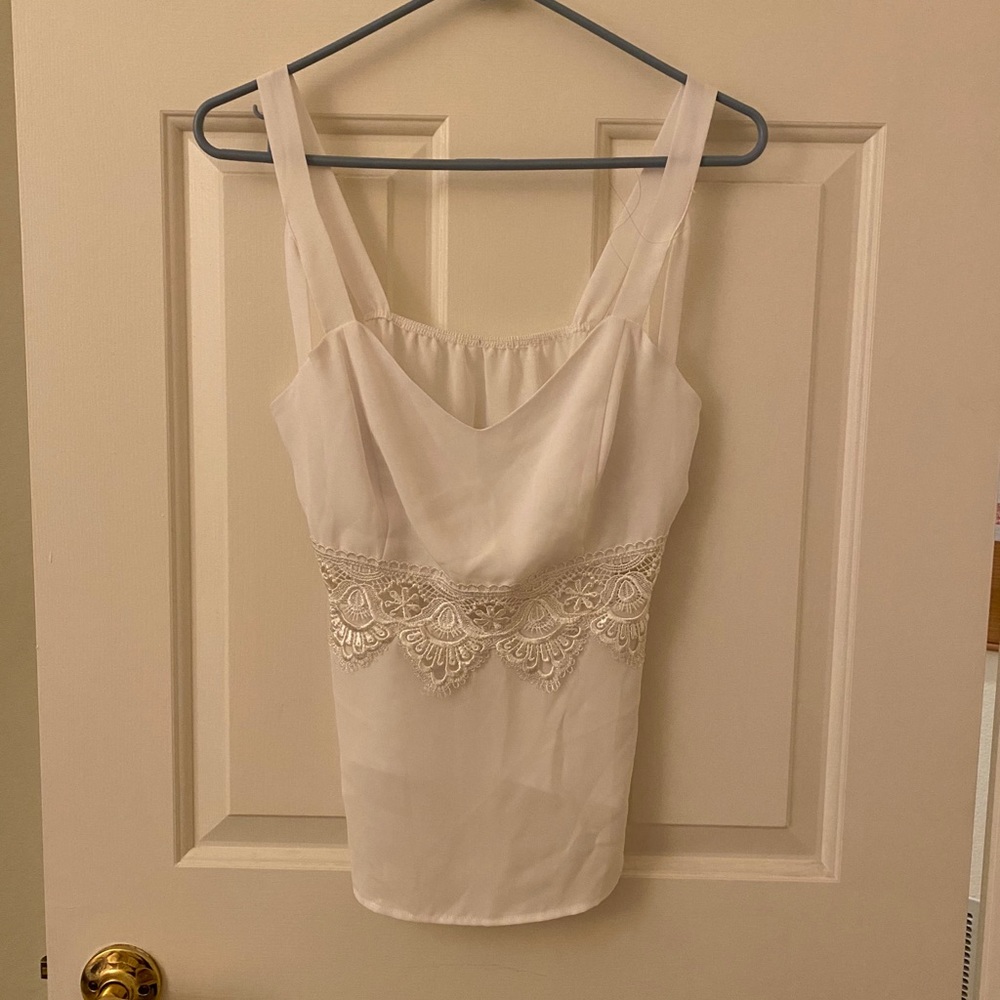 White sleeveless top